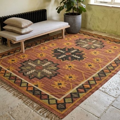 Red faded navajo wool and jute rug